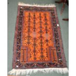 An orange knotted Persian rug