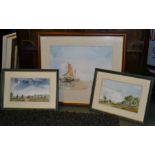 A watercolour seascape of boats on a beach with two other landscape watercolours