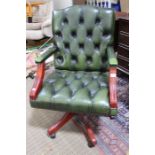 A reproduction Gainsborough design home office green leather effect button upholstered