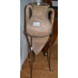 A Greek style terracotta pot on metal stand 53 cm high