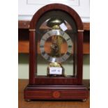A Sewills of Liverpool reproduction brass skeleton clock with bell strike in mahogany finish