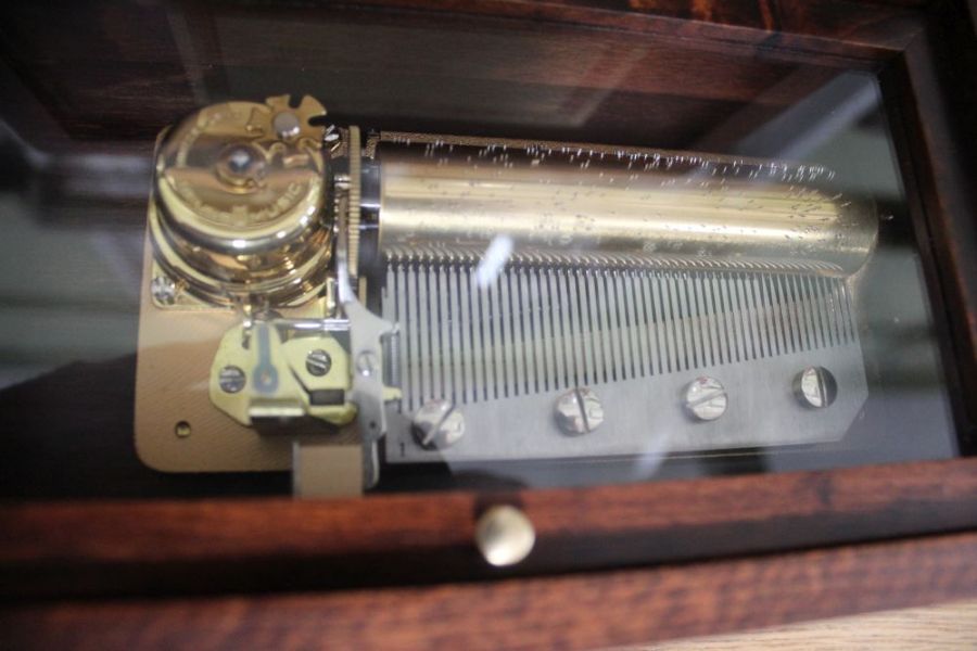 A "Reuge Music" wooden musical box. Decorated external lid to reveal hinged glass lid - Image 2 of 3