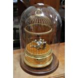 A "Reuge Music" two bird automata in a gilded cage with a glass dome protective cover