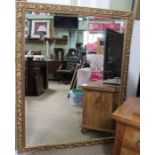A large fancy gilt framed rectangular bevel plate wall mirror