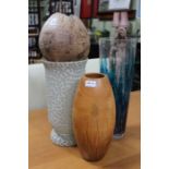 Three large decorative vessels and a coconut husk