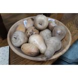 Turned wooden bowl containing turned wooden fruit