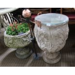 Two cast concrete pedestal planters