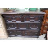 A mule chest having two faux drawers over full single drawer on block feet 84 x 107 cm
