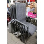 A set of four metal framed mesh garden armchairs with seat pads