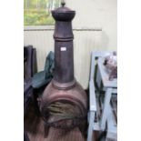 A free standing metal chimenea