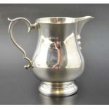 Adie Brothers, A Georgian design silver baluster cream jug, Birmingham 1931, weight: 100g