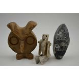 A 20th century Inuit articulated bone doll figure, 9.5cm high, together with a soapstone mask, and a