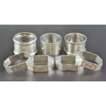 Barker Brothers Silver Ltd. A set of four silver napkin rings, Birmingham 1935, together with three