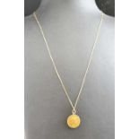 A 9ct gold "Queen Elizabeth ll" pendant suspended on a fine 14k chain, combined weight 3.5g