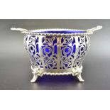 Mappin & Webb, A pierced silver bon-bon basket, with blue glass liner, Birmingham 1935, silver weigh