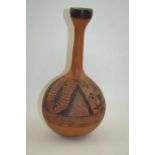 A 20th century African gourd with incised decoration, 33cm high