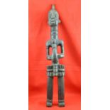 A 20th century carved wood standing figure, considered to be East African, 80cm high