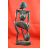 A 20th century African wood carving, combination bird & man figure, 58cm high