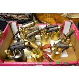A box containing eight vintage blowtorches