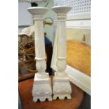 A pair of modern painted candle pricket candlesticks