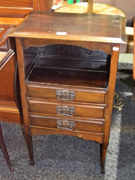 A mahogany music storage cabinet, three drawers