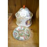 A famile rose decorated dish and a late 20th Century armorial lidded pot