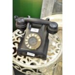An early Bakelite black GPO telephone, stamped "ATM"