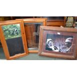 Three pine frames, one containing 'Carry On' photograph