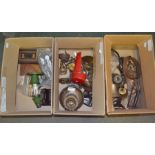 Three boxes containing a selection of domestic metalwares - bells and lamps etc