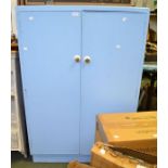 A blue painted child's size wardrobe