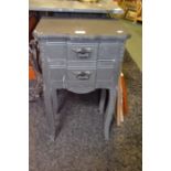 A pair of fancy bedside tables painted in grey