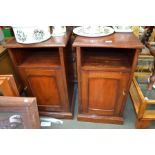 A pair of mahogany bed side cupboards