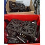 Two boxes of domestic metal wares the majority flatirons