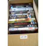 Fourteen assorted DVDs, adventure movies including "The Bourne Legacy", "Mad Max", and others
