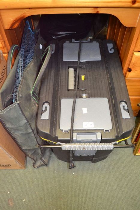 A large "Stanley" tool box with carry handle on wheels, containing a selection of fishing tackle