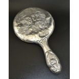Boots Pure Drug Company, an early 20th century embossed silver hand vanity mirror, decorated with An
