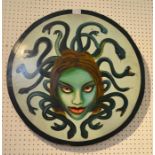 A painted wooden re-enactment shield with the face of Medusa