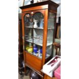 An Edwardian inlaid mahogany display case with blue damask interior