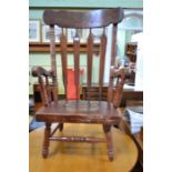 Slat back armchair with solid seat