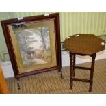 A small oak table together with a firescreen
