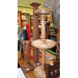 Three wooden carved table stands to display militaria etc