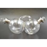 An early 20th century silver mounted blown glass oil & vinegar double cruet dispenser with handle &