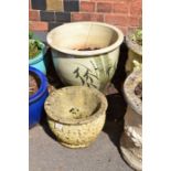 A large pottery garden planter hand painted with bamboo with a small cast concrete