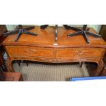 A reproduction walnut coloured Serpentine fronted two drawer side table