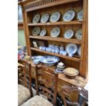 A European early 20th century pine one piece dresser having triple shelved plate rack