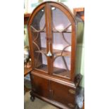 An Art Deco design oak display case on covered base