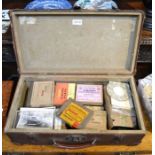 A vintage leather case containing a considerable selection of vintage photographic plates