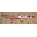 A wood and brass handled short re-enactment sword in leather scabbard