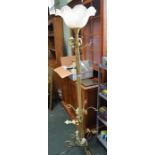 A floral decorated metal standard lamp