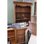 A small pine dresser with plate rack back